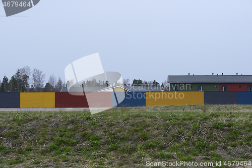 Image of fenced residential area, deadpan photo