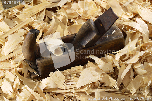 Image of a lot of fresh wood shavings and vintage planer