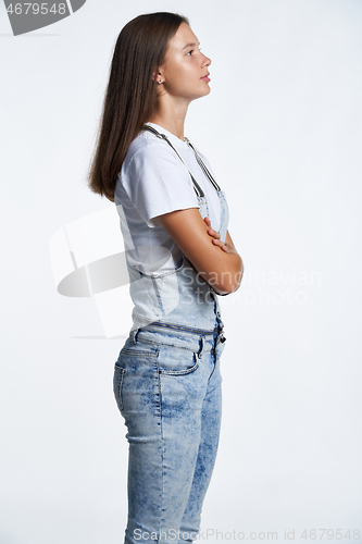 Image of Profile portrait of a teen girl standing looking in front