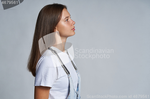 Image of Closeup profile portrait of a teen gir looking forward