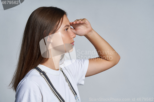 Image of Closeup profile portrait of a teen gir looking forward