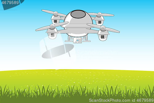 Image of Flying machine quadcopter in sky on green glade