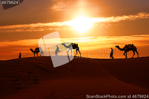 Image of Cameleers, camel Drivers at sunset. Thar desert on sunset Jaisal