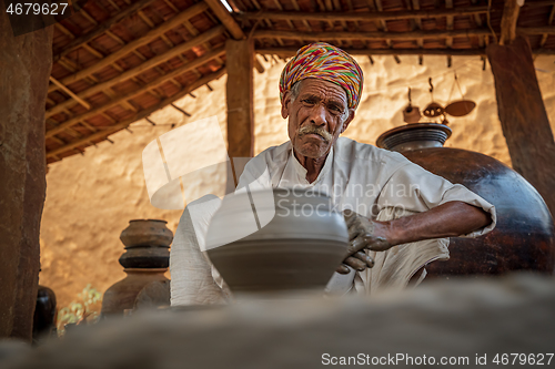 Image of Potter at work makes ceramic dishes. India, Rajasthan.