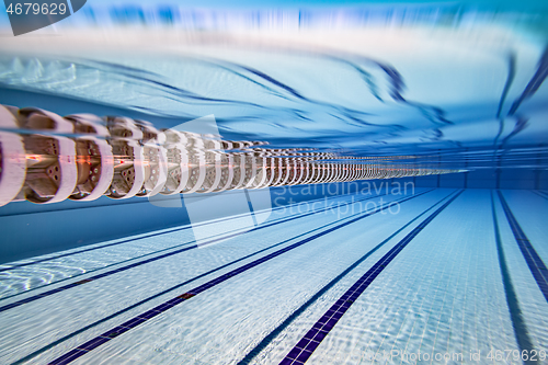 Image of Olympic Swimming pool under water background.