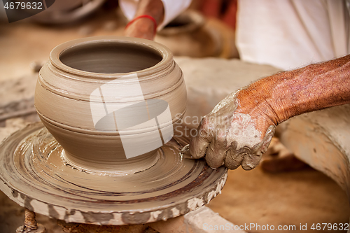 Image of Potter at work makes ceramic dishes. India, Rajasthan.