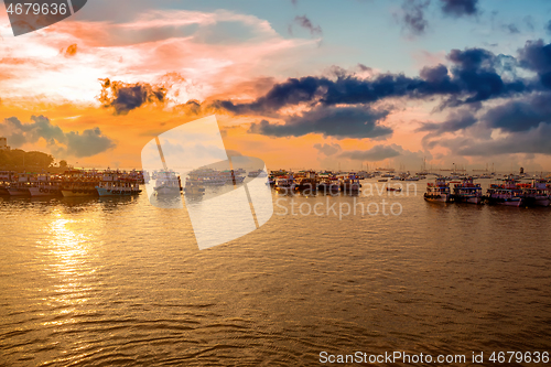 Image of Boats on Mumbai water at dawn. Colaba region of Mumbai, Maharash