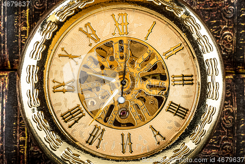 Image of Antique clock dial close-up. Vintage pocket watch.
