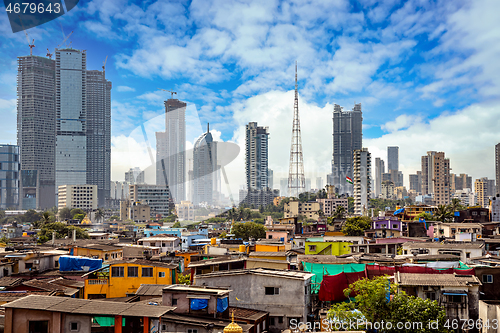 Image of Views of slums on the shores of mumbai, India against the backdr