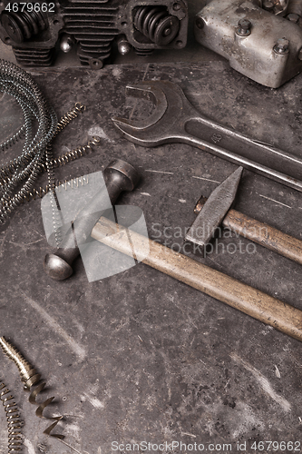 Image of Old tools set on a vintage metallic background with space for text