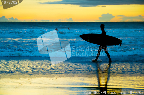 Image of Surfer at sunset, Bali island