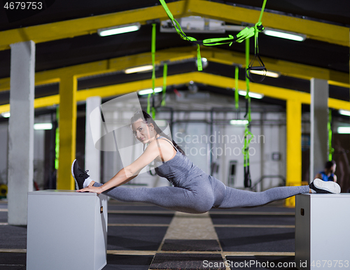 Image of woman working out gymnastic exercise on fit boxes