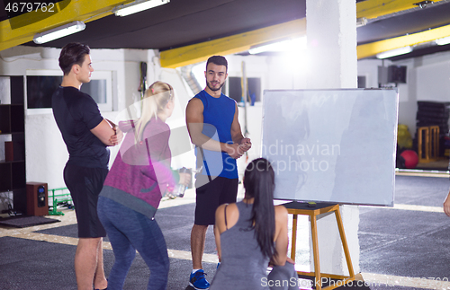 Image of athletes getting instructions from trainer