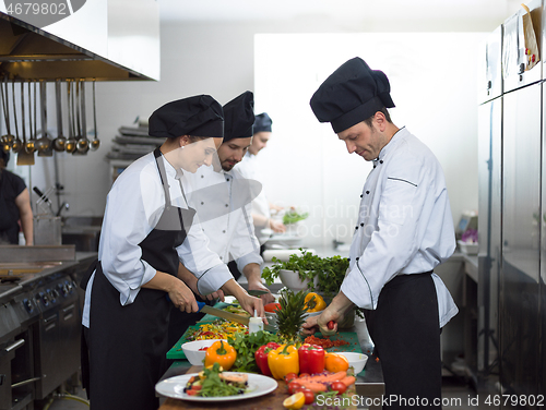 Image of team cooks and chefs preparing meals