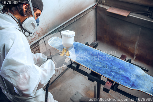 Image of Master painter in a factory