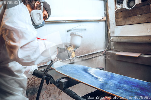 Image of Master painter in a factory