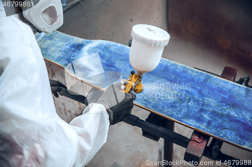 Image of Master painter in a factory