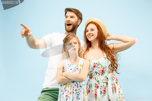 Image of Happy parent with daughter at studio isolated on blue background