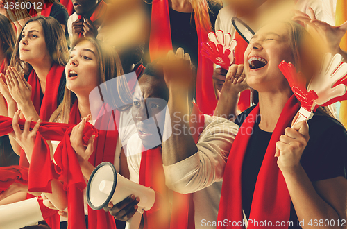 Image of Group of happy fans are cheering for their team victory.