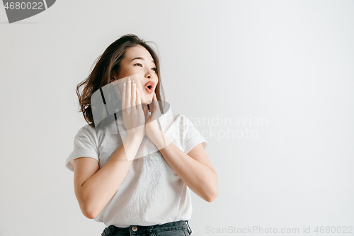 Image of Isolated on pink young casual woman shouting at studio