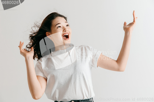 Image of Winning success woman happy ecstatic celebrating being a winner.