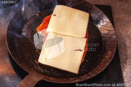 Image of Cheese escalope in a pan