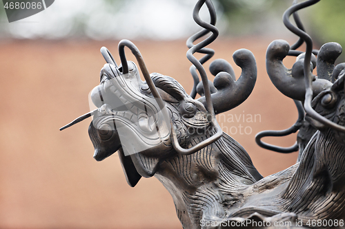 Image of Dragon sculpture in a temple in Hanoi, Vietnam