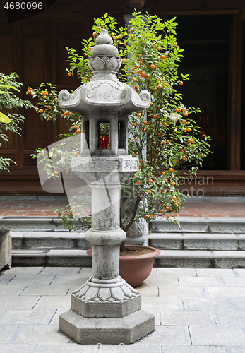 Image of Stone buddhist lamp in japanese garden