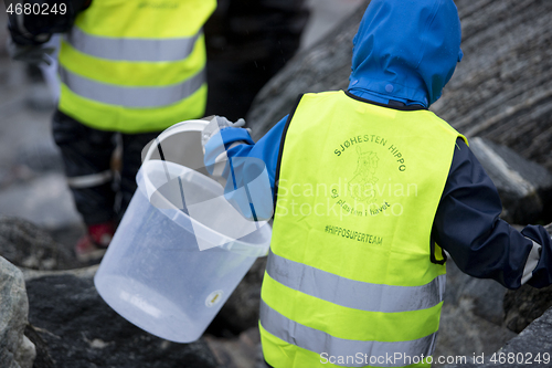 Image of Picking up Plastic Waste