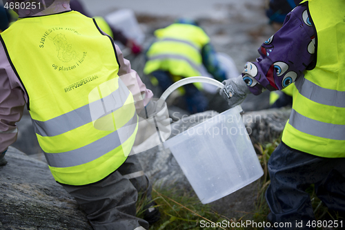 Image of Picking up Plastic Waste