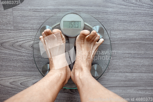 Image of Human feet on electronic scales