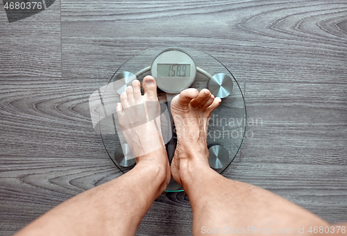 Image of Human feet on electronic scales