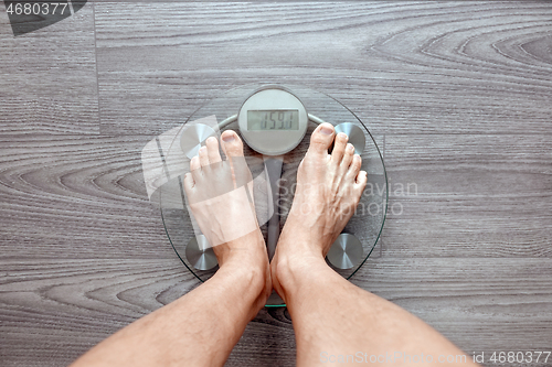 Image of Human feet on electronic scales