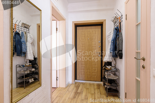 Image of The interior of a habitable hallway in a small one-room apartment