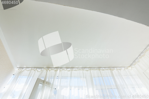 Image of Stretch ceiling in a glazed loggia in an apartment building