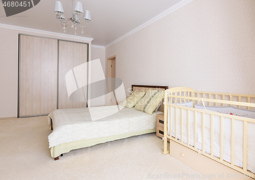 Image of Bedroom interior with new born baby crib