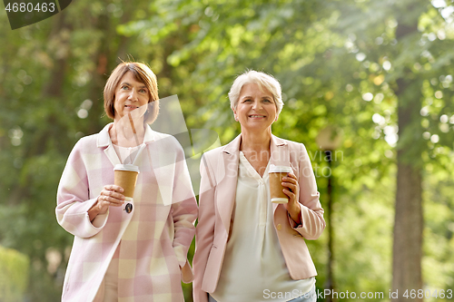 Image of senior women or friends drinking coffee at park