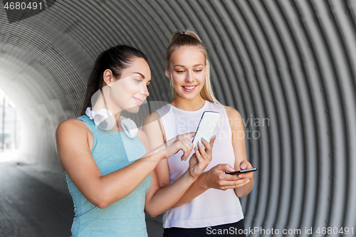 Image of women or female friends with smartphones