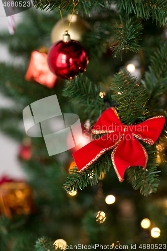 Image of close up of decorations on christmas tree