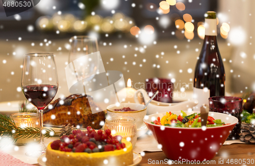 Image of food and drinks on christmas table at home