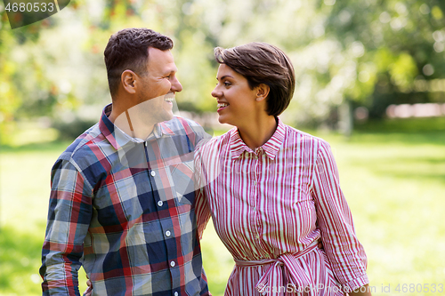 Image of happy couple in summer park