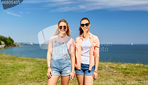 Image of teenage girls or best friends at seaside in summer