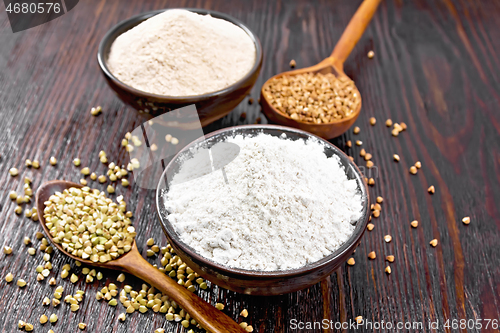 Image of Flour buckwheat green and brown in bowls on dark wooden board