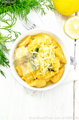 Image of Gnocchi pumpkin with lemon in bowl on board top