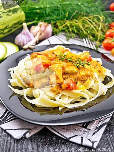 Image of Pasta with goulash in plate on napkin