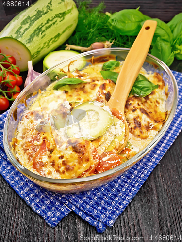 Image of Zucchini baked with tomatoes in glass pan on table