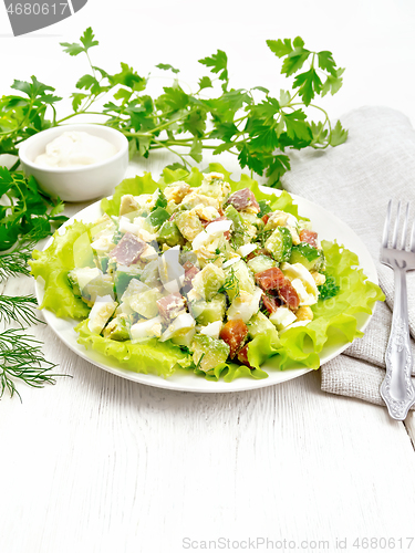 Image of Salad of salmon and avocado on table