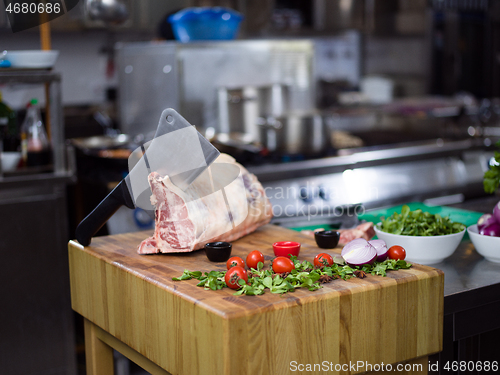 Image of chef cutting big piece of beef