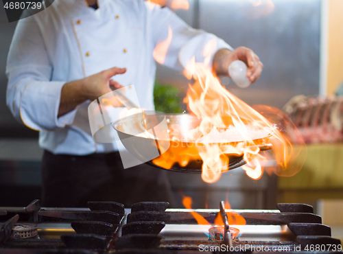 Image of Chef doing flambe on food