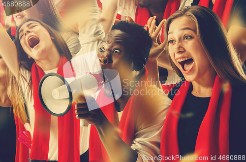 Image of Group of happy fans are cheering for their team victory.